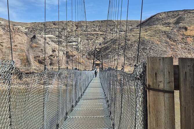 1 Day Guided Drumheller Tour: Calgary to Dinosaur Badlands - A swaying crossing at Rosedale Suspension Bridge