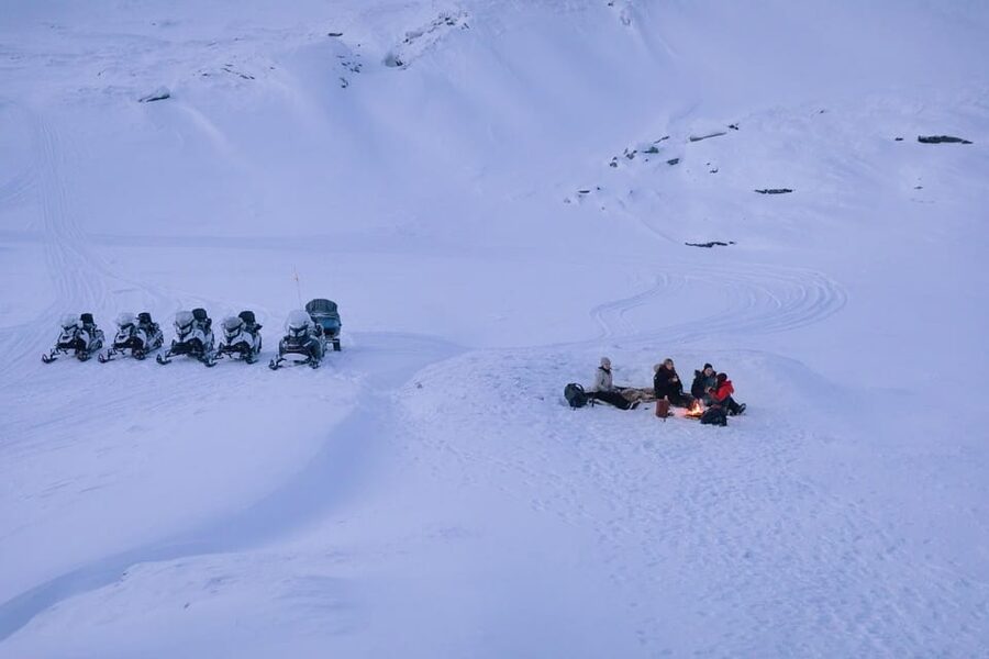Abisko: Great Outback Snowmobile Tour with Lake Abiskojaure - Getting dressed for a northern Swedish ride