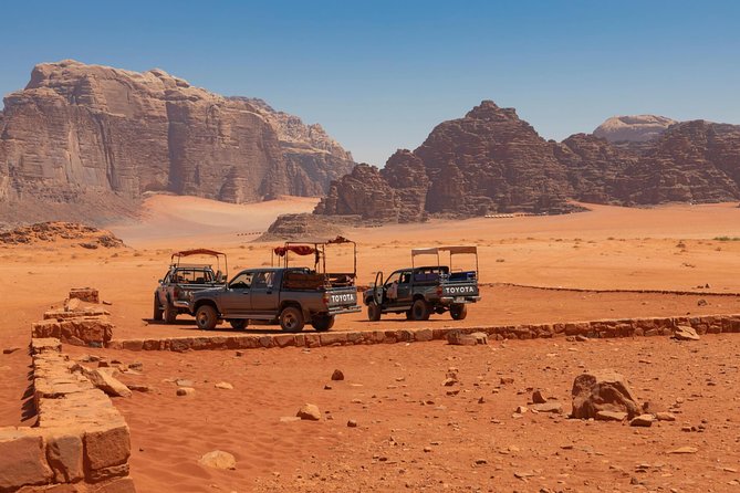 Best of Wadi Rum | Full day Jeep tour + Sleep under the stars | Pack all-in - Red sand, arches, and wide desert views