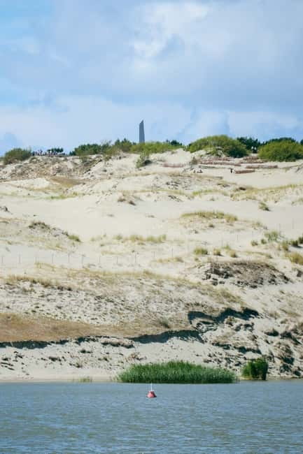 Day group tour: Curonian Spit (Neringa) from Klaipeda (EN) - Nida’s Sun Clock, promenade, and lagoon
