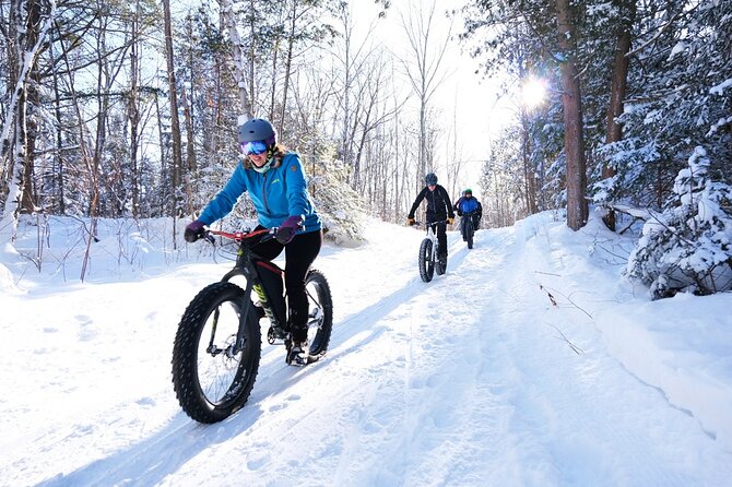 Electric Fat Biking Adventure in Banff | Small Group Adventure - The Banff town sign and Fairmont Banff Springs