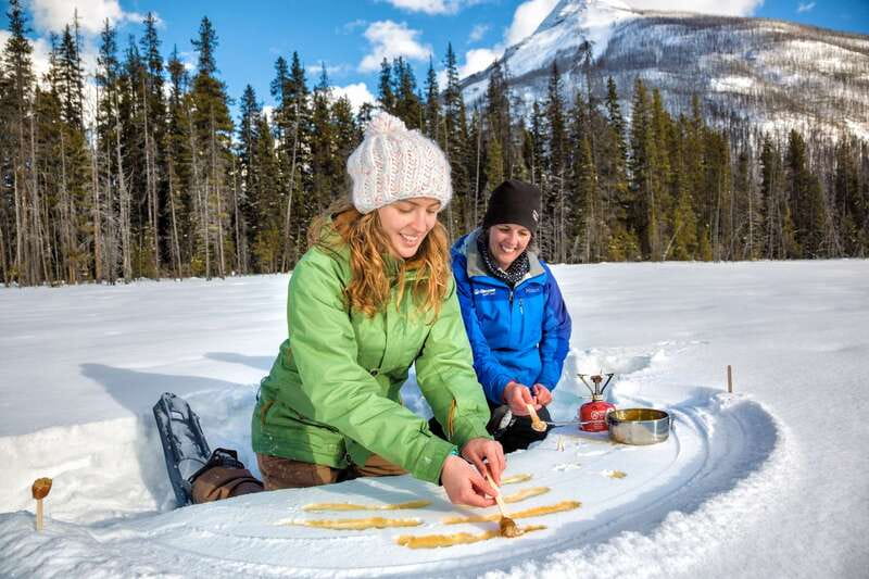 From Banff: Snowshoeing Tour in Kootenay National Park - Crossing the Vermilion River toward the Paint Pots