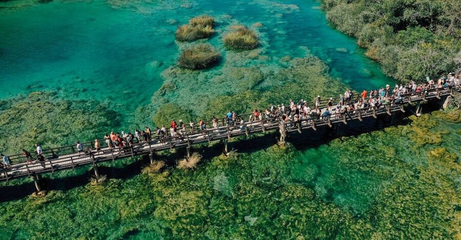 From Split: Krka Waterfalls Tour with Boat Cruise & Swimming - Wooden paths and the falls at Skradinski Buk