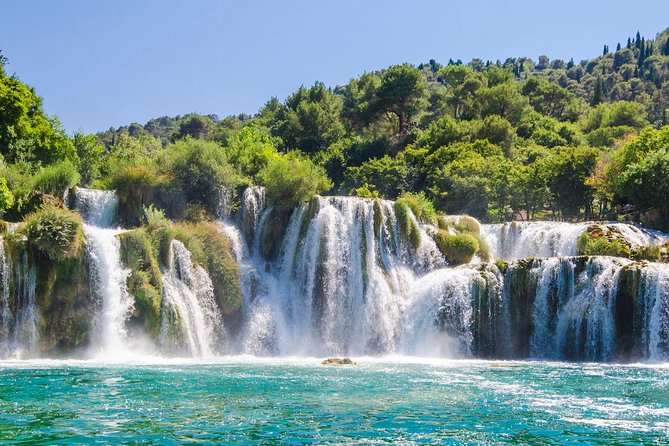 Krka Waterfalls tour with Boat Ride and Swimming in Skradin town - Walking the wooden paths of Krka National Park