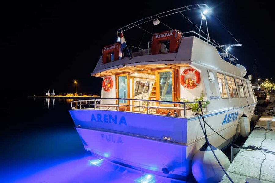 Pula: Brijuni Dolphins Sunset Cruise with Dinner and Drinks - Leaving Pula harbor aboard the Arena