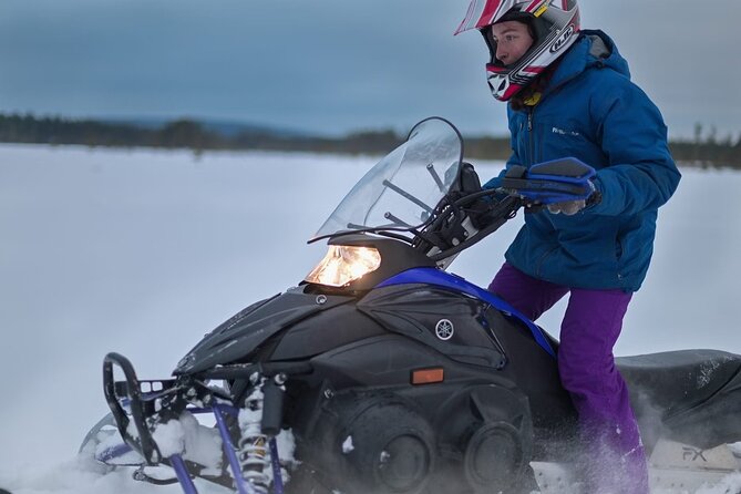 Rovaniemi: Drive New 2025 Snowmobiles on Arctic Safari & BBQ - Getting dressed for cold-weather driving