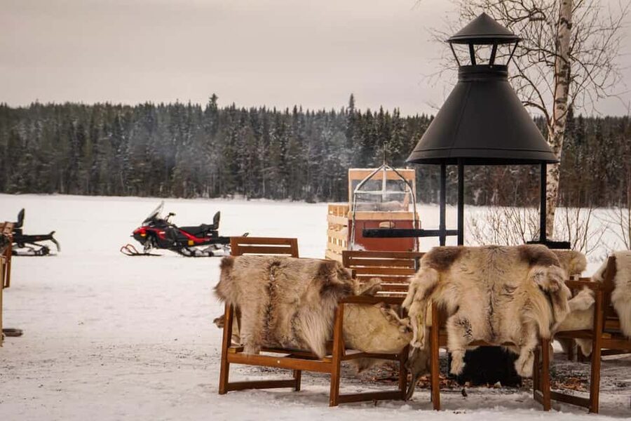 Rovaniemi: Guided Wilderness Snowmobile Safari & Barbeque - Riding across the frozen lake