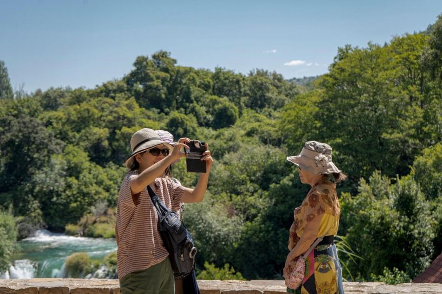 Split: Krka Waterfalls With Boat Cruise, Wine and Olive Oil - Walking the wooden paths around Skradinski buk