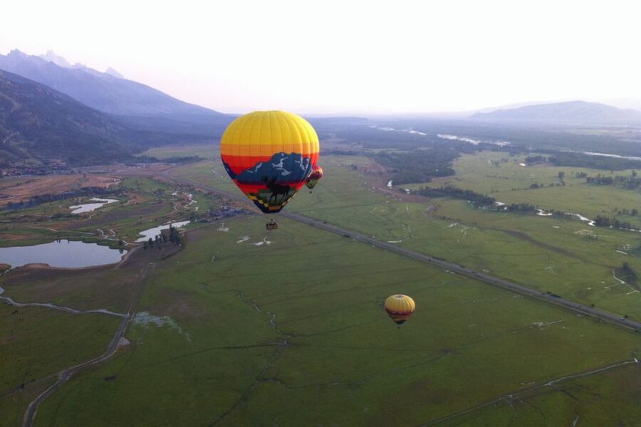 Teton Village: Grand Tetons Sunrise Hot Air Balloon Tour - Sunrise over Jackson Hole from a mile up