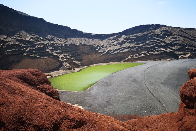 Tour to Timanfaya, La Geria and La Laguna Verde - El Lago Verde and the black-sand coast