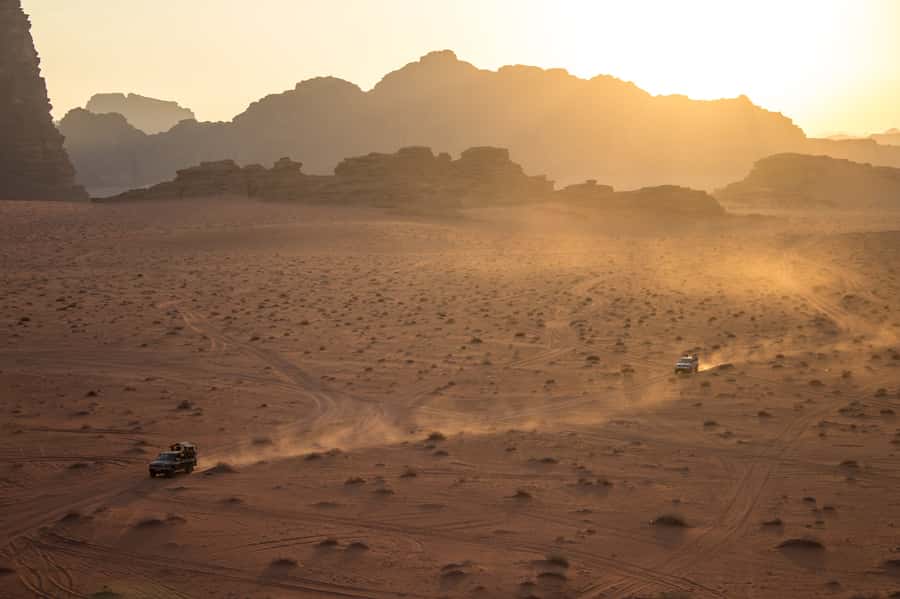 Wadi Rum: Explore 10-Hour Jeep Tour Pass, Guide, Meal & Stay - Jeep stops, rock sites, and red sand