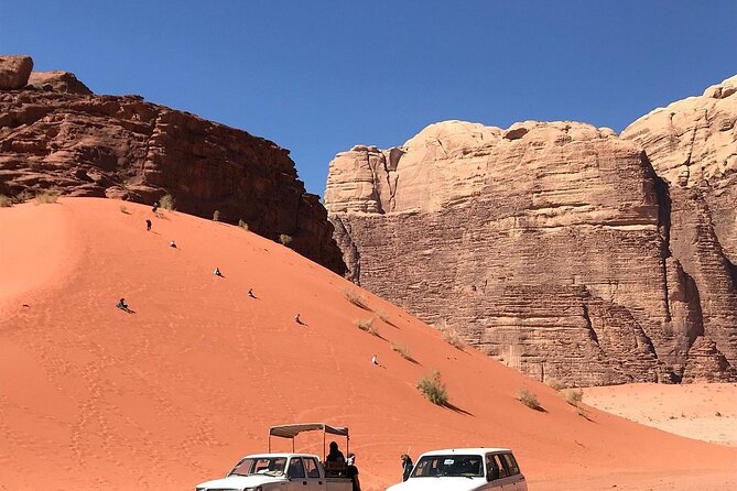 Wadi Rum Short Tours - Climbing the big red sand dune