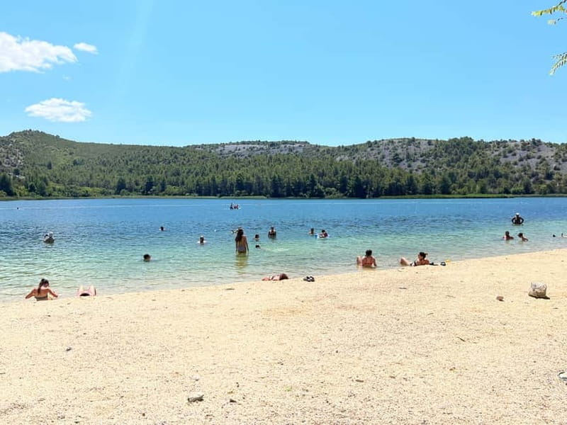 Zadar: Krka Waterfalls Tour, Boat Cruise & Swimming - Skradin gives the day a second rhythm